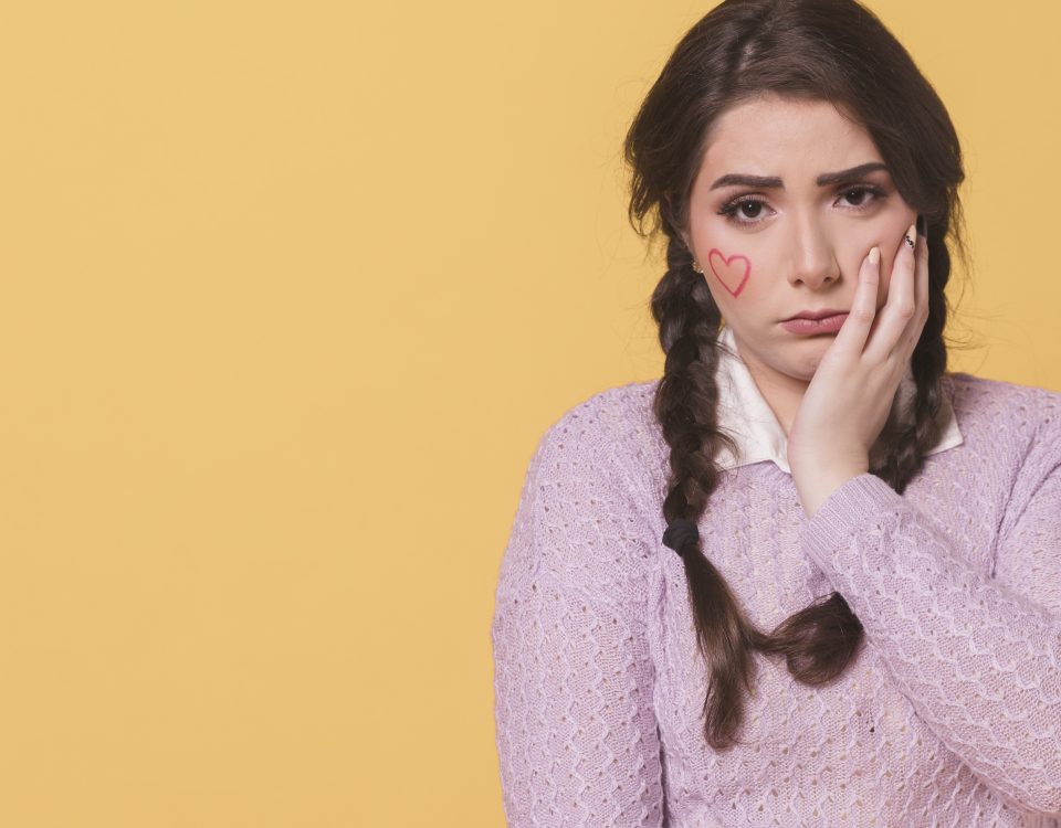 sad woman with ponytails copy space
